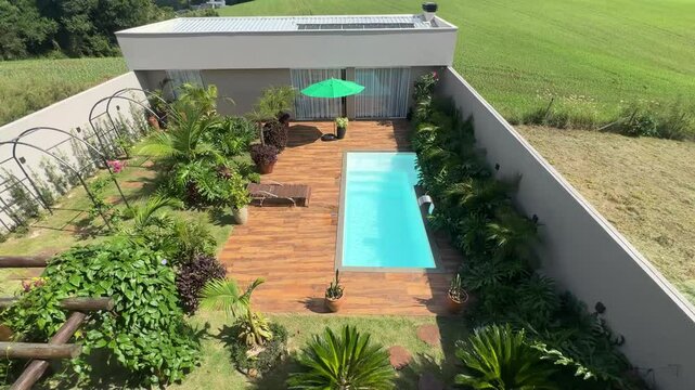 casa com area de lazer com piscina e paisagismo tropical 