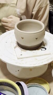 Pottery creation at an art studio during afternoon session