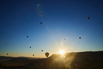 Balloons lifted into the air in Cappadocia. Entertainment and tourist attraction. A spectacular sight