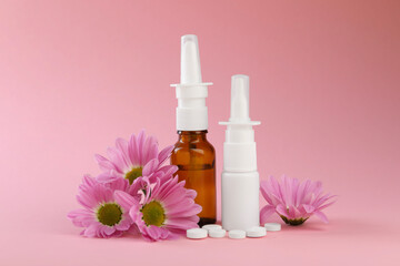 Allergy treatment. Different medications and flowers on pink background