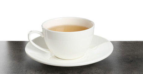 Refreshing green tea in cup on grey textured table against white background