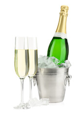 Champagne in glasses and ice bucket with bottle isolated on white