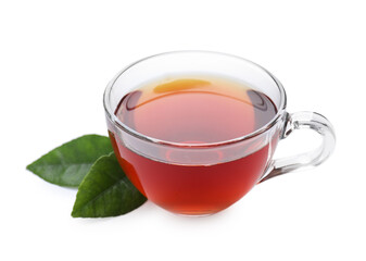 Refreshing black tea in cup and leaves isolated on white