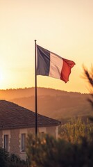 A French flag stands proudly before a traditional chateau, basking in the glow of a stunning sunset