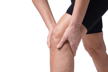 Woman suffering from pain in her knee on white background, closeup