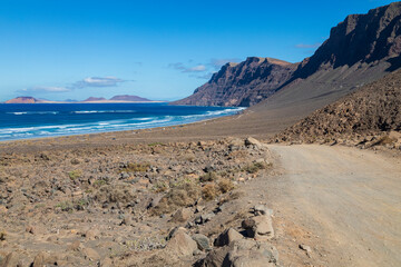 Sea Meets Mountain/An image showing where the Atlantic Ocean meets the volcanic mountain range called Risco De Famara, shot in Lanzarote, Canary Islands, Spain,