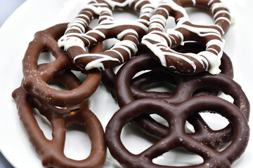 Assorted Chocolate-Covered Pretzels on a White Plate