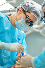team of surgeons is working in the operating room