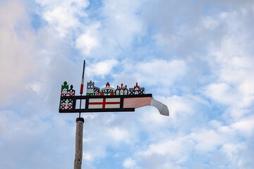national symbol in the form of a flag against the background of a beautiful blue sky