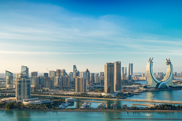 Lusail, Qatar - December 20, 2024: Katara buildings view from Lusail Marina Park. Crescent Tower 