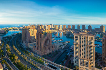 Doha, Qatar - December 20, 2024: Aerial view of Peral Qatar Porto Arabia with Doha Skyline early morning.