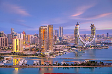 Lusail, Qatar - December 20, 2024: Katara buildings view from Lusail Marina Park. Crescent Tower 