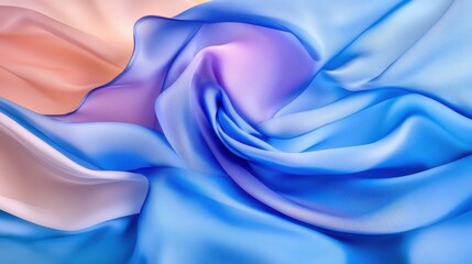 Obraz premium Soft flowing silk fabric in pastel blue, pink, and lavender tones creating an elegant abstract swirl.