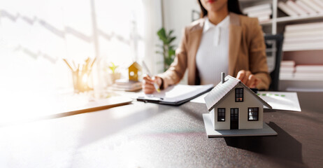 Real Estate Broker agent's signature on the contract finalized the mortgage agreement, marking a...