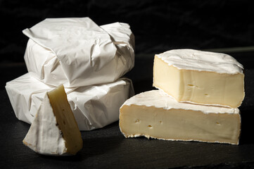 Delicious creamy brie cheese! Perfect for food photography, recipes, or showcasing gourmet dairy products. Available in wrapped and cut portions