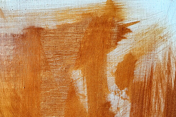Abstract painterly orange color texture on grainy canvas, brush strokes, background.