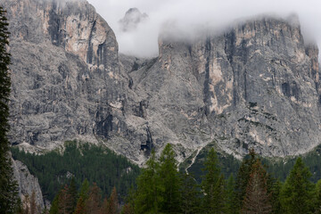 View of the Dolomites reveals the origin of Cascate del Pisciadu, where water flows from towering...