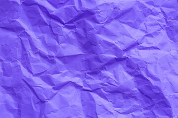 Obraz premium Close-up of purple crumpled paper texture,Abstract light purple paper texture background. Texture of crumpled craft paper. Paper background. Recycled violet paper backdrop in close up. indigo Textures