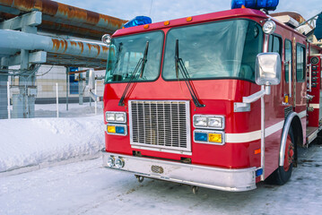 Naklejka premium A fire truck for delivering firefighters to the fire site and supplying fire extinguishing agent. Fire and rescue equipment. Emergency rescue service.