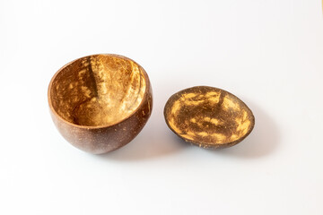 A handcrafted coconut shell, cut, smoothed, and varnished to be used as a bowl or cup