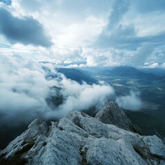 Obraz premium Majestic mountain peaks rising above the clouds