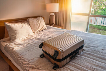 Stylish travel essentials on cozy bed