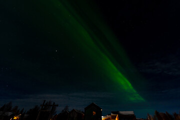 Fototapeta premium Aurora Borealis - Northern Lights - over frozen lake Akaslompolo in Finnish Lapland.