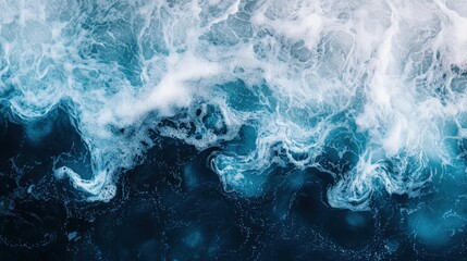 Obraz premium A wave in the ocean with a lot of foam and bubbles