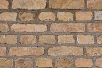 The photo shows a close-up of a brick wall of a building