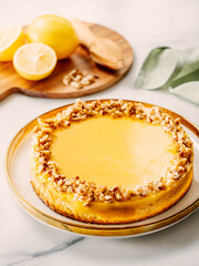 Lemon tart or lemon cake, decorated walnuts