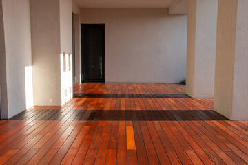 Modern architecture atrium house with concrete walls and hardwood deck