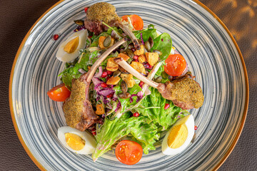 food, lamb chops with herb crust on a crisp salad