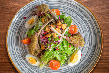 food, lamb chops with herb crust on a crisp salad