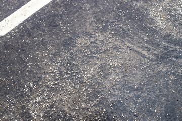 marble and granite chips on surface of road