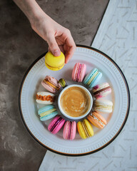 A variety of different macarons. A variety of colors and flavors of French almond dessert