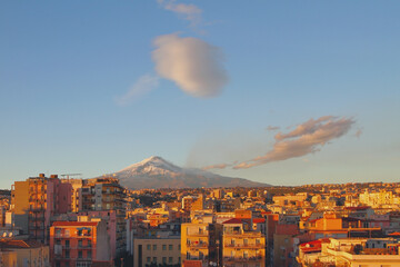 City, volcano and rare clouds at sunset. Catania, Sicily, Italy