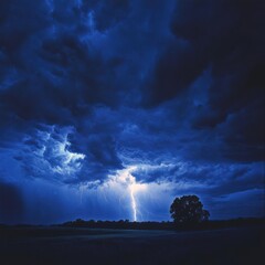 Fototapeta premium A stormy sky with a lightning bolt and a tree in the foreground