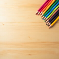 Fototapeta premium colored pencils on wooden table