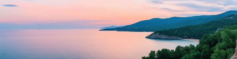 A beautiful ocean view with a pink and orange sky. The water is calm and the sky is clear