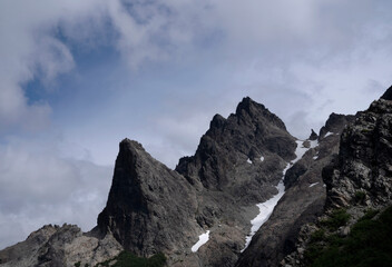 Alpine landscape in summer. View of the rocky mountain peak in Cerro Lopez, Bariloche, Argentina	
