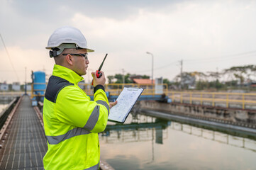 Environmental engineers work at wastewater treatment plants,Water supply engineering working at Water recycling plant for reuse