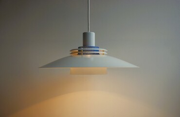 Shining ceiling lamp in multi layer design.