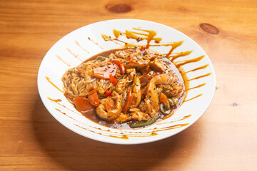 Flavorful chicken and vegetables in a savory sauce on a wooden table