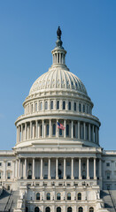 Fototapeta premium U.S. Capitol Building: A Symbol of American Democracy and Architecture Under a Clear Blue Sky, Washington D.C. Landmark