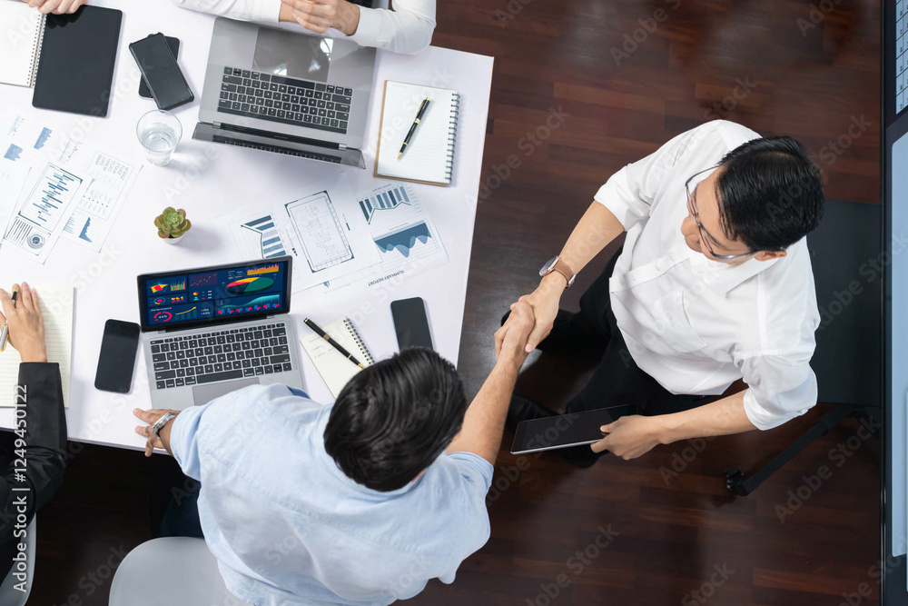 Poster top view diverse office employee worker shake hand after making agreement on strategic business mark