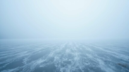 Obraz premium Serene Winter Landscape with Thick Fog Over Frozen Water Surface