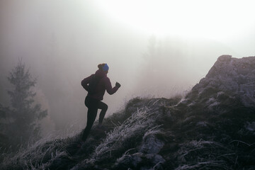 Trail Runner in Misty Mountain Landscape