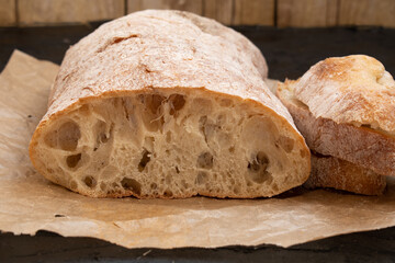 Fresh ciabatta bread on parchment paper