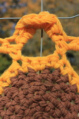 yarn crochet in bright orange and brown