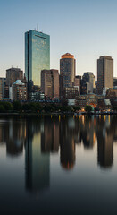 Fototapeta premium Boston Skyline Serenity: Captivating Cityscape at Dusk Reflected in Charles River Calm Waters - An Urban Evening Dream